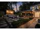 Evening shot of backyard featuring a pool, spa, and outdoor dining area at 820 Highland Ne Ter, Atlanta, GA 30306