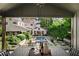 Scenic backyard view featuring a pool, cabana, lush landscaping, and the home's exterior at 820 Highland Ne Ter, Atlanta, GA 30306
