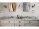 Bathroom vanity with marble countertop, double sinks, and stylish lighting at 820 Highland Ne Ter, Atlanta, GA 30306