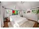 Airy bedroom with white linens, shaggy rug and bright light with a view from the windows at 820 Highland Ne Ter, Atlanta, GA 30306