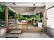 Beautiful covered patio with comfortable seating, a swing, and views of the pool at 820 Highland Ne Ter, Atlanta, GA 30306