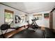Bright exercise room featuring wood floors, black workout mats and plenty of professional workout equipment at 820 Highland Ne Ter, Atlanta, GA 30306