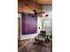 Cozy home office boasts exposed brick flooring and a comfortable Eames lounge chair at 820 Highland Ne Ter, Atlanta, GA 30306