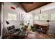Modern home office with a vaulted ceiling, hardwood floors, and natural light at 820 Highland Ne Ter, Atlanta, GA 30306