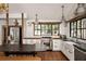 Bright kitchen featuring stainless steel appliances, white cabinetry, an island, and natural light at 820 Highland Ne Ter, Atlanta, GA 30306