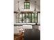 Close-up of a well-lit kitchen with white cabinetry, black countertops, and stainless steel appliances at 820 Highland Ne Ter, Atlanta, GA 30306