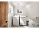 Bright laundry room with washer, dryer, and marble countertop at 820 Highland Ne Ter, Atlanta, GA 30306