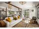 Open living room and kitchen layout, featuring stylish lighting, comfortable seating, and natural light at 820 Highland Ne Ter, Atlanta, GA 30306