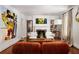 Bright living room features a fireplace, built-in shelves, and large artwork at 820 Highland Ne Ter, Atlanta, GA 30306