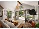 Bright living room with view of a pool area, comfortable seating, and French doors at 820 Highland Ne Ter, Atlanta, GA 30306