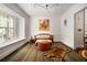 Bright living room with hardwood floors, unique lighting, and a large window with a view at 820 Highland Ne Ter, Atlanta, GA 30306