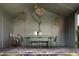 Covered outdoor dining area with table, chairs, and decorative chandeliers at 820 Highland Ne Ter, Atlanta, GA 30306