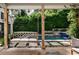 Inviting outdoor space with a swing, lush greenery, and a view of the refreshing pool at 820 Highland Ne Ter, Atlanta, GA 30306