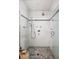 Modern shower with white subway tile and gray accent stripe at 820 Highland Ne Ter, Atlanta, GA 30306