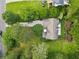 Aerial view of the house showing the yard, patio, and surrounding greenery at 117 Laguna Springs Dr, Woodstock, GA 30188