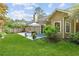 Lush backyard with a patio, flowers, and plenty of space to relax and entertain at 117 Laguna Springs Dr, Woodstock, GA 30188