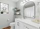 Bright bathroom featuring tiled floors, a decorative window, and sleek hardware at 117 Laguna Springs Dr, Woodstock, GA 30188