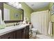 Cozy bathroom with framed mirror, decorative accents, and combination shower and bathtub at 117 Laguna Springs Dr, Woodstock, GA 30188