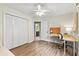 Well-lit bedroom includes a desk, large closet, and neutral decor at 117 Laguna Springs Dr, Woodstock, GA 30188