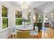 Bright breakfast nook featuring large windows, natural light and a modern chandelier at 117 Laguna Springs Dr, Woodstock, GA 30188