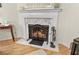 Elegant marble fireplace with decorative screen and mantle at 117 Laguna Springs Dr, Woodstock, GA 30188