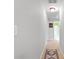 Hallway with neutral paint and lighting leading to other rooms in the home at 117 Laguna Springs Dr, Woodstock, GA 30188