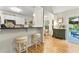 Bright kitchen with a breakfast bar, white cabinets, and modern pendant lighting at 117 Laguna Springs Dr, Woodstock, GA 30188