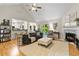 Spacious living area with fireplace, vaulted ceiling, and open layout to the kitchen at 117 Laguna Springs Dr, Woodstock, GA 30188