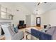 Cozy living room showcasing a fireplace, vaulted ceiling, and comfortable seating at 117 Laguna Springs Dr, Woodstock, GA 30188