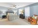 Airy main bedroom with elegant decor, comfortable bedding, and a cozy rocking chair at 117 Laguna Springs Dr, Woodstock, GA 30188