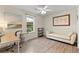 Bright office space with desk, daybed, and natural light creating an inspiring work environment at 117 Laguna Springs Dr, Woodstock, GA 30188