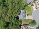 Bird's eye view of a house in a cul-de-sac, surrounded by lush green trees, offering privacy and tranquility at 117 Willow View Ln, Canton, GA 30114