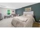 Basement bedroom with a plush bed, large window, and a bright, inviting ambiance at 117 Willow View Ln, Canton, GA 30114