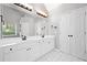 Bathroom features double vanity with granite countertops, a large mirror, and modern fixtures at 117 Willow View Ln, Canton, GA 30114