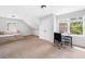 Loft bedroom with windows, daybed, and study area at 117 Willow View Ln, Canton, GA 30114