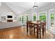 View of the dining room open to the bright living room, with access to outdoor deck at 117 Willow View Ln, Canton, GA 30114