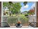 Cozy front porch view showcasing outdoor seating and a glimpse of the beautifully landscaped neighborhood at 117 Willow View Ln, Canton, GA 30114