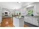 Open floor plan kitchen view showcasing granite countertops, island, and connected living area at 117 Willow View Ln, Canton, GA 30114
