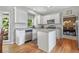 Charming kitchen with white cabinetry, granite countertops, and an island at 117 Willow View Ln, Canton, GA 30114