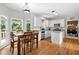 Kitchen with white cabinetry, granite countertops, and breakfast area with outdoor view at 117 Willow View Ln, Canton, GA 30114