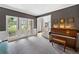 Cozy living room with a piano, and a walkout to a balcony at 117 Willow View Ln, Canton, GA 30114