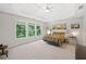 Spacious main bedroom featuring a tray ceiling, large windows, and neutral decor, offering a serene retreat at 117 Willow View Ln, Canton, GA 30114