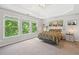 Bright main bedroom boasts large windows, tray ceiling, and natural light at 117 Willow View Ln, Canton, GA 30114