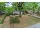 Aerial shot showing the home's placement among mature trees in a natural setting at 2505 Mellville Ave, Decatur, GA 30032