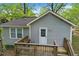 View of the back of the home showing siding, back door, and wooden deck at 2505 Mellville Ave, Decatur, GA 30032