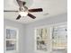 Bright bedroom featuring a ceiling fan and multiple windows at 2505 Mellville Ave, Decatur, GA 30032