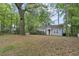 Cozy single-story home with a charming yard and mature trees providing shade at 2505 Mellville Ave, Decatur, GA 30032