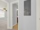 Hallway view leading to a bedroom and bathroom, showcasing the home's layout and neutral tones at 2505 Mellville Ave, Decatur, GA 30032