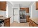 Convenient kitchen area with stainless steel fridge, washer, and dryer at 2505 Mellville Ave, Decatur, GA 30032