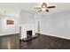 Open living room features a brick fireplace and seamlessly connects to the kitchen at 2505 Mellville Ave, Decatur, GA 30032